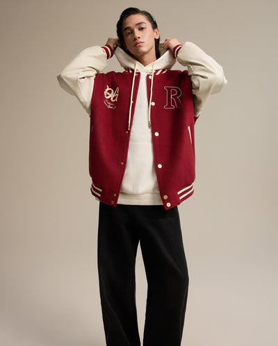 1011266-611 | MEN'S RICH LOGO LOOSE FIT VARSITY JACKET | SUN-DRIED TOMATO